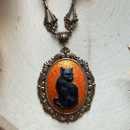 BLACK CAT Necklace - large w/orange glitter - antique brass