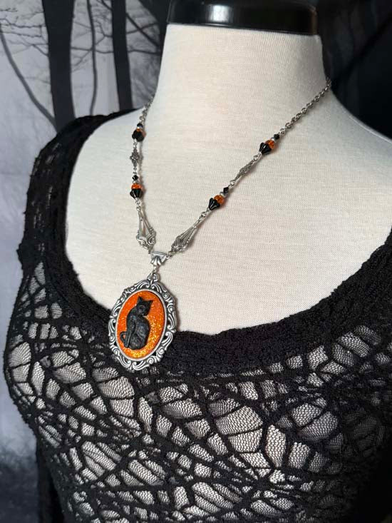 BLACK CAT Necklace - large w/orange glitter - antique silver