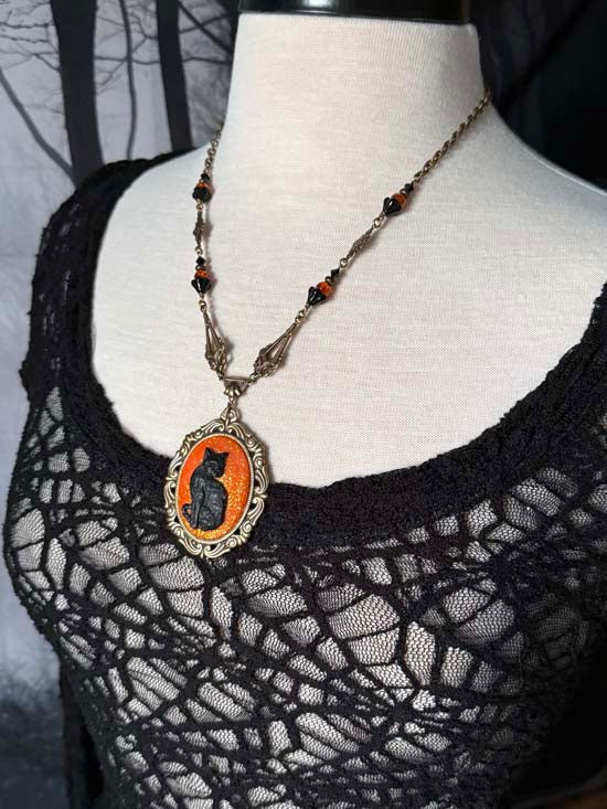 BLACK CAT Necklace - large w/orange glitter - antique brass