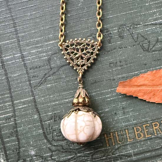 Ghostly Pumpkin Patch Necklace - antique brass